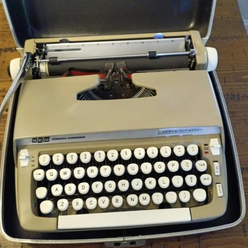 SCM Smith-Corona Super Sterling Portable Manual Typewriter with Case and Key